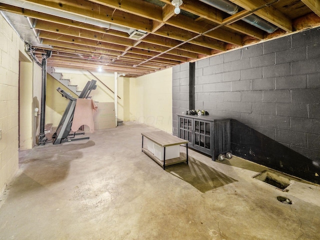 7121 Briarcliff Rd, Reynoldsburg, OH 43068 - unfinished basement featuring stairs and concrete block wall