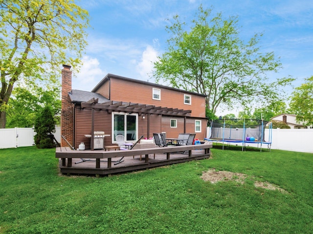 7121 Briarcliff Rd, Reynoldsburg, OH 43068 - rear view of property with a pergola, a trampoline, a wooden deck, a chimney, and a shingled roof