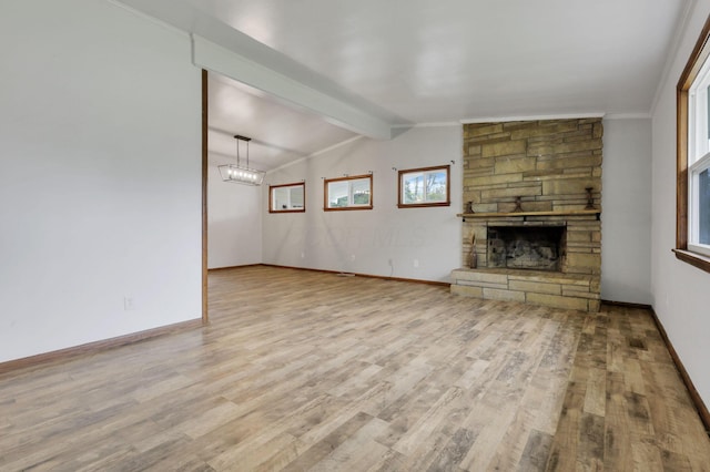 269 N 30th St, Newark, OH 43055 - unfurnished living room with wood finished floors, a fireplace, and baseboards