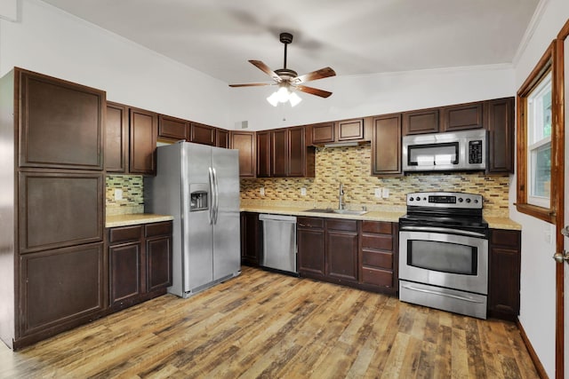 269 N 30th St, Newark, OH 43055 - kitchen with stainless steel appliances, a sink, ceiling fan, light countertops, and light wood-style floors