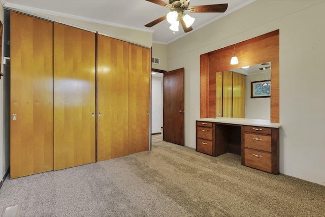 269 N 30th St, Newark, OH 43055 - unfurnished bedroom featuring light colored carpet, crown molding, a closet, an office area, and ceiling fan