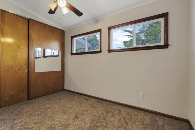269 N 30th St, Newark, OH 43055 - empty room featuring carpet floors, ornamental molding, vaulted ceiling, a ceiling fan, and baseboards