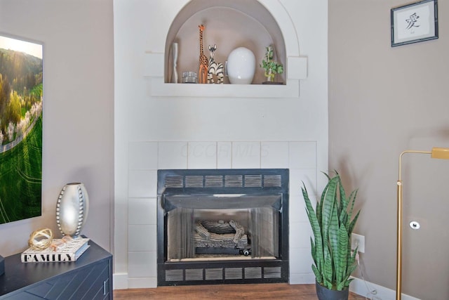 3297 Joshstock Dr Unit 3297D, Columbus, OH 43232 - detailed view of a fireplace, wood finished floors, and baseboards