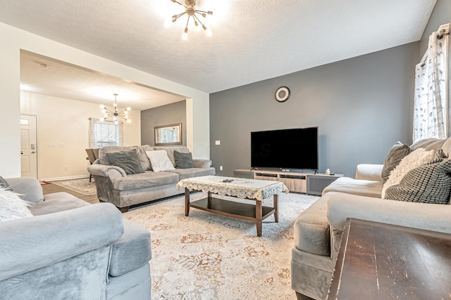 42 Carolyn Ln, Delaware, OH 43015 - living area with a chandelier and a textured ceiling