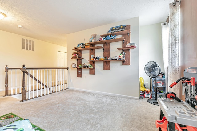 42 Carolyn Ln, Delaware, OH 43015 - game room with carpet floors, a textured ceiling, and baseboards