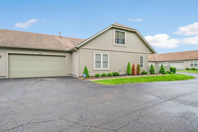 2348 Willowside Ln, Grove City, OH 43123 - view of front facade featuring asphalt driveway, a garage, and roof with shingles