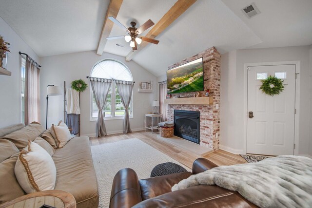 2348 Willowside Ln, Grove City, OH 43123 - living room with ceiling fan, wood finished floors, a fireplace, and baseboards