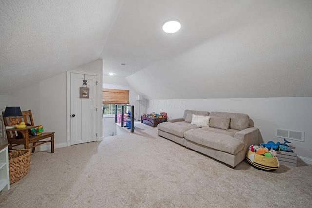 2348 Willowside Ln, Grove City, OH 43123 - carpeted living room featuring lofted ceiling and baseboards