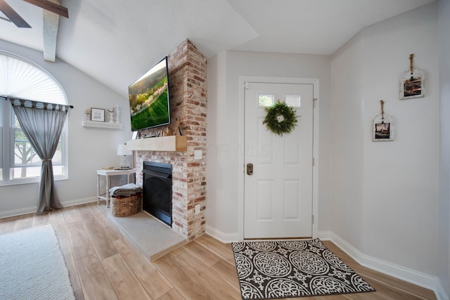 2348 Willowside Ln, Grove City, OH 43123 - entrance foyer with light wood-style flooring, healthy amount of natural light, and a brick fireplace