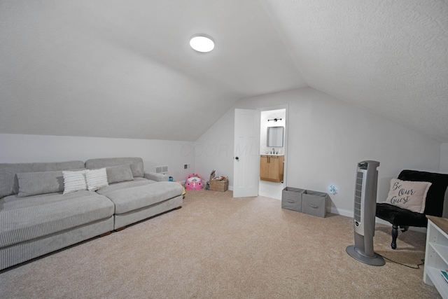 2348 Willowside Ln, Grove City, OH 43123 - carpeted living area featuring lofted ceiling and a textured ceiling