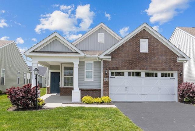6051 Limewood Dr, Westerville, OH 43081 - craftsman inspired home featuring brick siding, driveway, board and batten siding, covered porch, and an attached garage