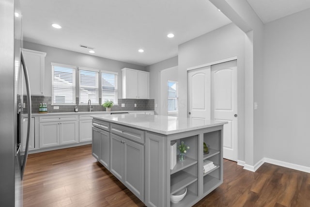 6051 Limewood Dr, Westerville, OH 43081 - kitchen featuring plenty of natural light, tasteful backsplash, open shelves, a center island, and recessed lighting