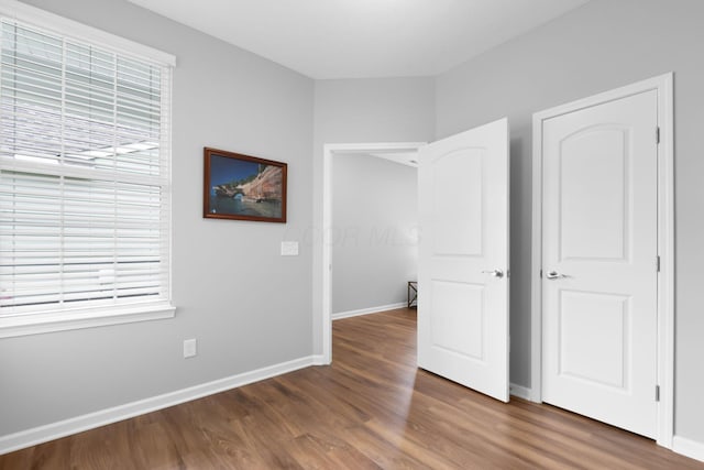 6051 Limewood Dr, Westerville, OH 43081 - unfurnished bedroom with wood finished floors and baseboards