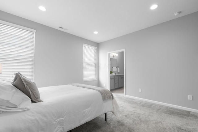 6051 Limewood Dr, Westerville, OH 43081 - bedroom with light colored carpet, baseboards, recessed lighting, multiple windows, and connected bathroom