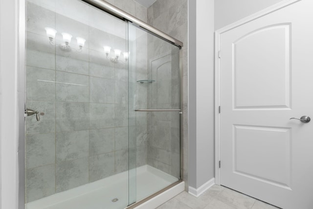 6051 Limewood Dr, Westerville, OH 43081 - bathroom featuring a shower stall, baseboards, and tile patterned floors