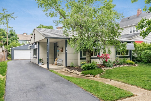 214 Arden Rd, Columbus, OH 43214 - view of front of house featuring a front yard, a garage, and an outbuilding