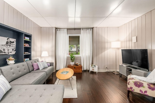 214 Arden Rd, Columbus, OH 43214 - living area featuring dark wood finished floors, wooden walls, and baseboards