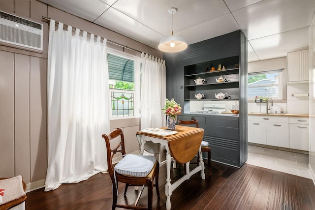 214 Arden Rd, Columbus, OH 43214 - dining room with dark wood-style floors and an AC wall unit
