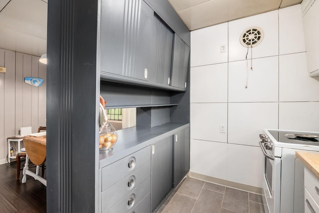 214 Arden Rd, Columbus, OH 43214 - kitchen with white electric range oven, light countertops, and gray cabinetry