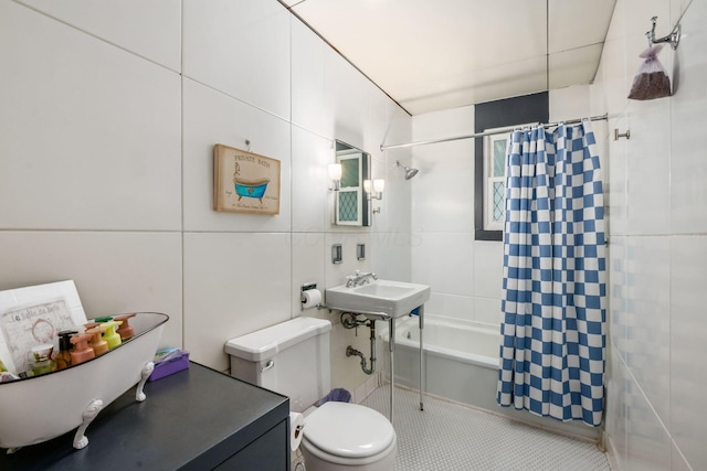 214 Arden Rd, Columbus, OH 43214 - full bath featuring tile walls, shower / tub combo, toilet, a sink, and tile patterned floors