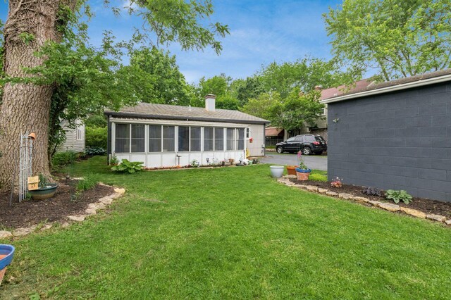 214 Arden Rd, Columbus, OH 43214 - view of green lawn with a sunroom