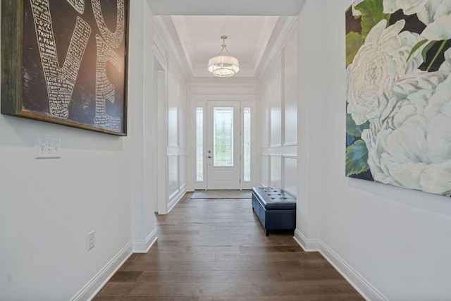 1526 Villa Way, Powell, OH 43065 - entryway featuring crown molding, dark wood-style floors, a chandelier, and baseboards