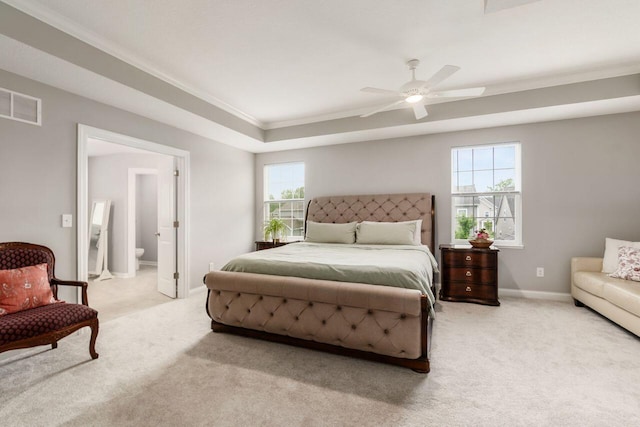 7306 Whimbrel Ln, Sunbury, OH 43074 - carpeted bedroom with crown molding, a tray ceiling, baseboards, connected bathroom, and ceiling fan