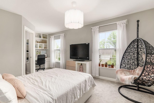 7306 Whimbrel Ln, Sunbury, OH 43074 - carpeted bedroom featuring multiple windows, a desk, and baseboards