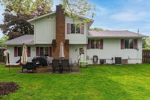 1392 Brenthaven Pl, Columbus, OH 43228 - back of house featuring a chimney, a shingled roof, and a patio area