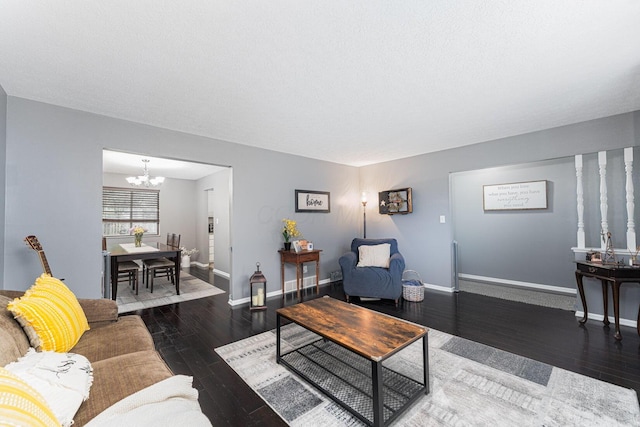 1392 Brenthaven Pl, Columbus, OH 43228 - living room with a chandelier, hardwood / wood-style floors, and baseboards