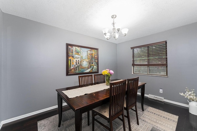1392 Brenthaven Pl, Columbus, OH 43228 - dining area with a chandelier, wood finished floors, baseboards, and a textured ceiling