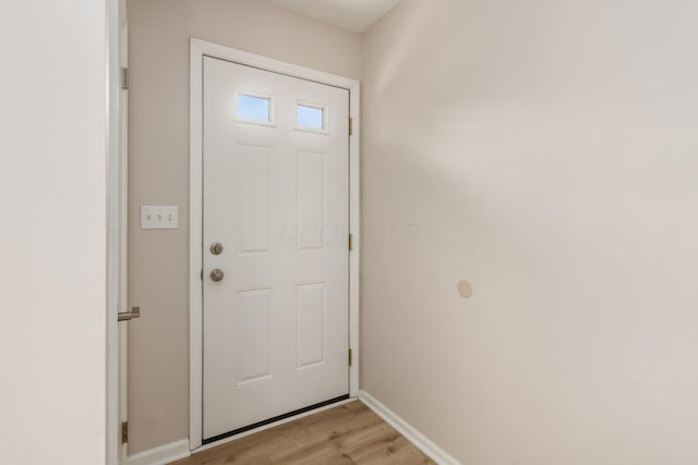 2353 Mccauley Ct Unit 6, Columbus, OH 43220 - doorway to outside featuring light wood-style flooring and baseboards