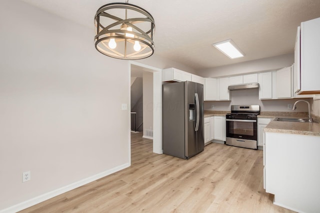 2353 Mccauley Ct Unit 6, Columbus, OH 43220 - kitchen with appliances with stainless steel finishes, a sink, under cabinet range hood, light wood-style flooring, and light countertops