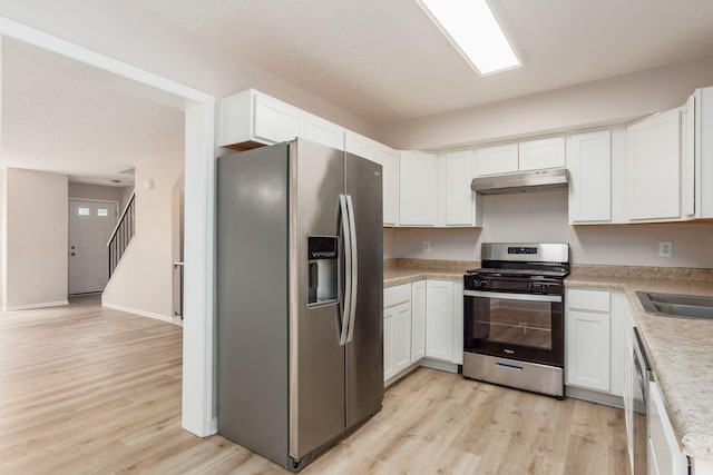 2353 Mccauley Ct Unit 6, Columbus, OH 43220 - kitchen featuring appliances with stainless steel finishes, under cabinet range hood, light wood-style flooring, and light countertops