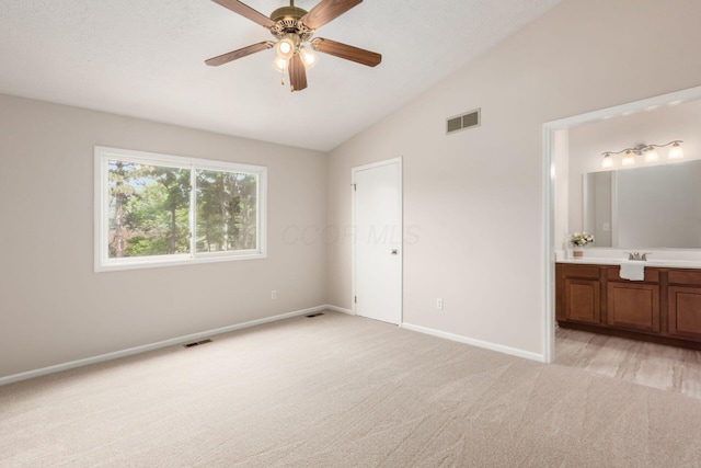 2353 Mccauley Ct Unit 6, Columbus, OH 43220 - unfurnished bedroom featuring light colored carpet, vaulted ceiling, baseboards, connected bathroom, and a sink