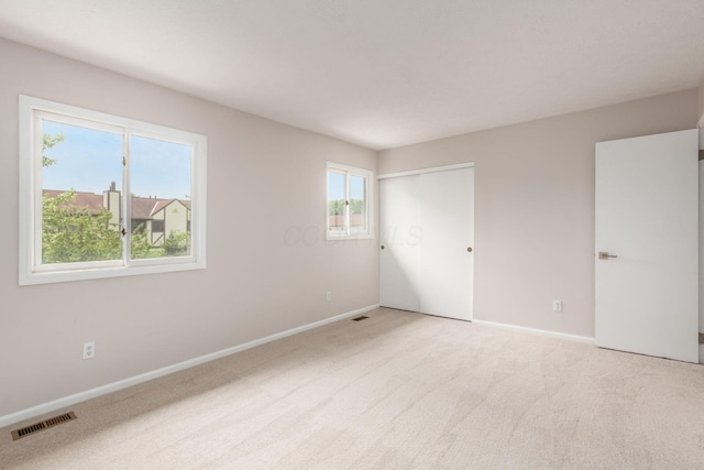 2353 Mccauley Ct Unit 6, Columbus, OH 43220 - unfurnished bedroom featuring carpet, baseboards, and a closet