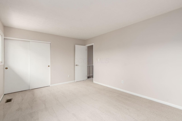 2353 Mccauley Ct Unit 6, Columbus, OH 43220 - unfurnished bedroom with baseboards, light colored carpet, and a closet