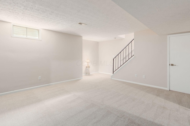 2353 Mccauley Ct Unit 6, Columbus, OH 43220 - below grade area with carpet floors, stairway, a textured ceiling, and baseboards