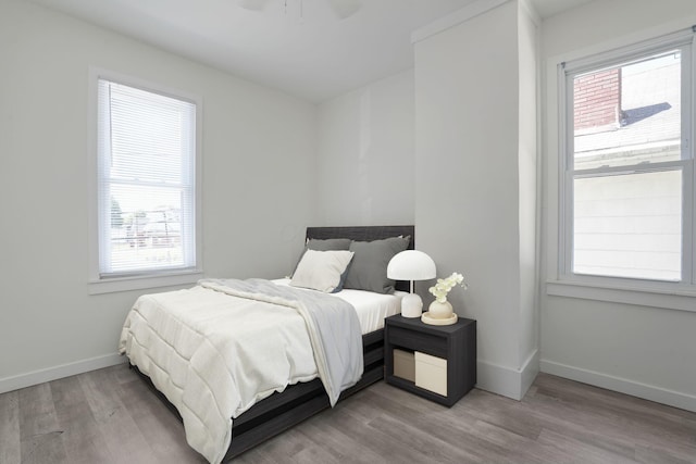 2278 Ridgeway Ave, Columbus, OH 43219 - bedroom featuring baseboards, wood finished floors, and a ceiling fan