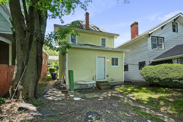2278 Ridgeway Ave, Columbus, OH 43219 - rear view of property featuring entry steps and a chimney
