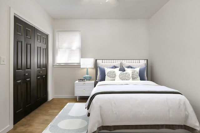 2278 Ridgeway Ave, Columbus, OH 43219 - bedroom featuring wood finished floors, a closet, a ceiling fan, and baseboards