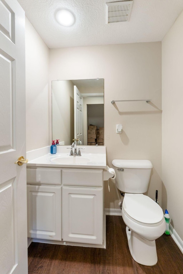 1080 Shady Lake Dr, Columbus, OH 43228 - bathroom with wood finished floors, toilet, vanity, and baseboards