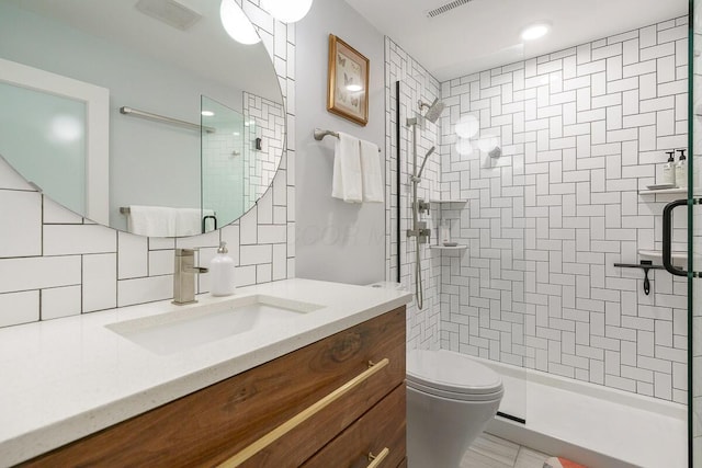 232 Hardy Way, Worthington, OH 43085 - bathroom featuring vanity, decorative backsplash, a tile shower, and toilet