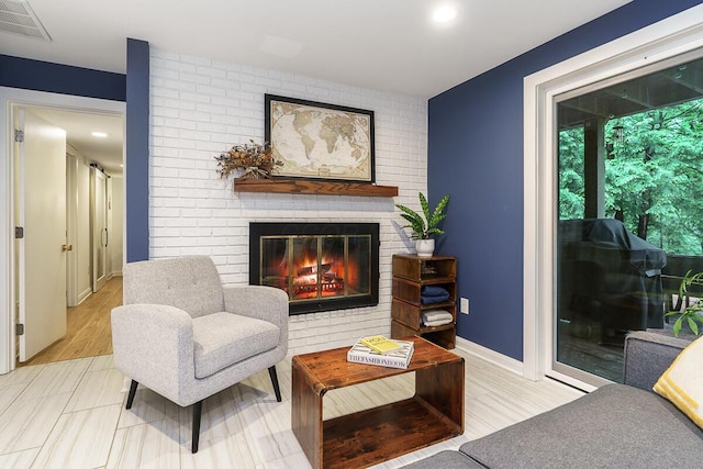 232 Hardy Way, Worthington, OH 43085 - living area featuring a brick fireplace, baseboards, and recessed lighting