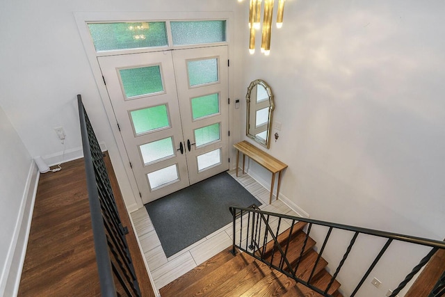 232 Hardy Way, Worthington, OH 43085 - foyer with french doors, wood finished floors, stairs, and baseboards