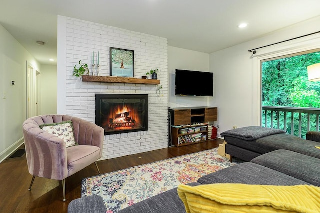 232 Hardy Way, Worthington, OH 43085 - living area featuring wood finished floors, a brick fireplace, recessed lighting, and baseboards