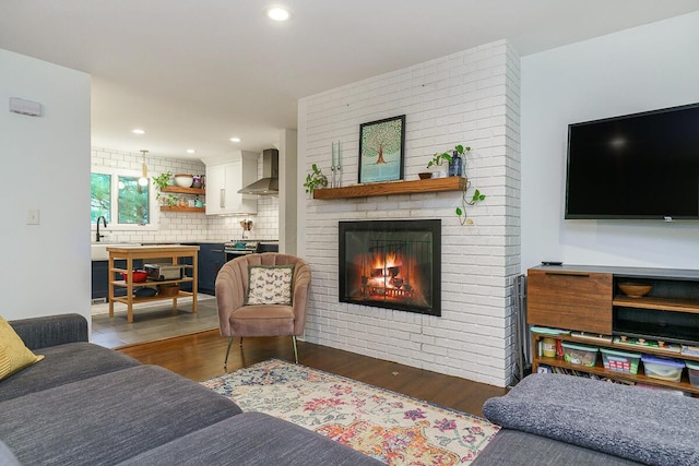 232 Hardy Way, Worthington, OH 43085 - living area with wood finished floors, a fireplace, and recessed lighting