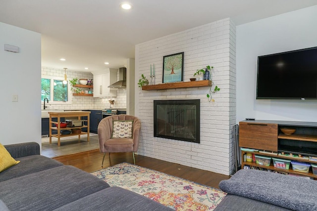 232 Hardy Way, Worthington, OH 43085 - living room with wood finished floors, a fireplace, and recessed lighting