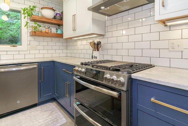 232 Hardy Way, Worthington, OH 43085 - kitchen featuring stainless steel appliances, blue cabinets, wall chimney exhaust hood, and light countertops