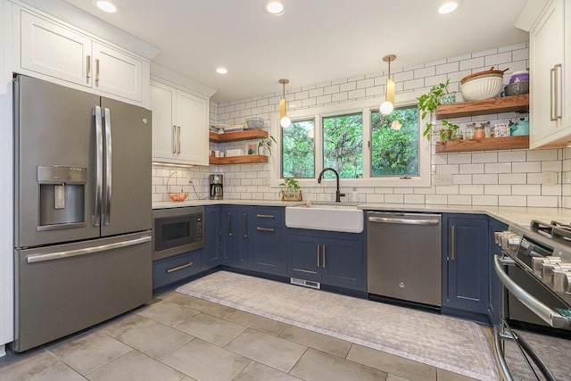 232 Hardy Way, Worthington, OH 43085 - kitchen with appliances with stainless steel finishes, open shelves, a sink, white cabinetry, and blue cabinets